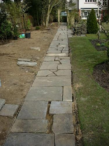 The paving slabs re-laid before infilling with sand and cement