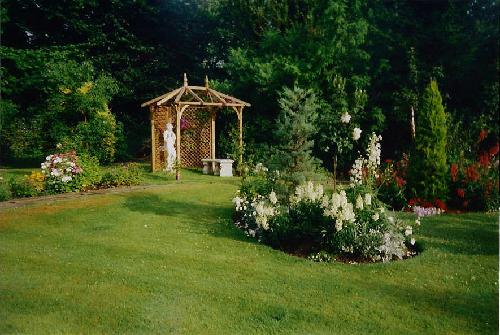The circular beds leading to the pergola