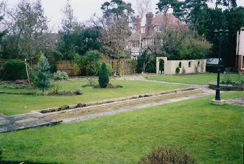 The long bed with the wall in the distance